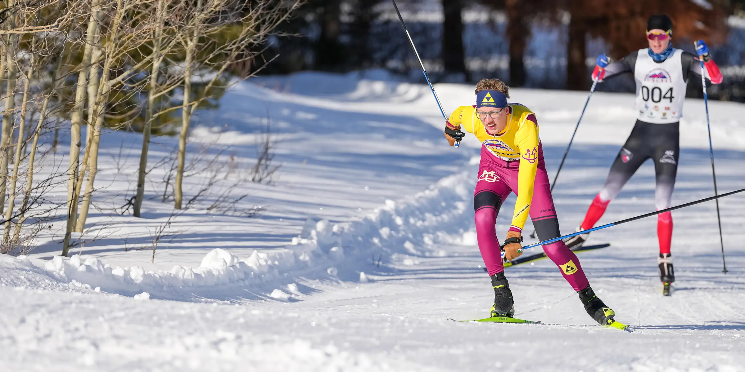 CMU cross country skier racing through a snowy forest