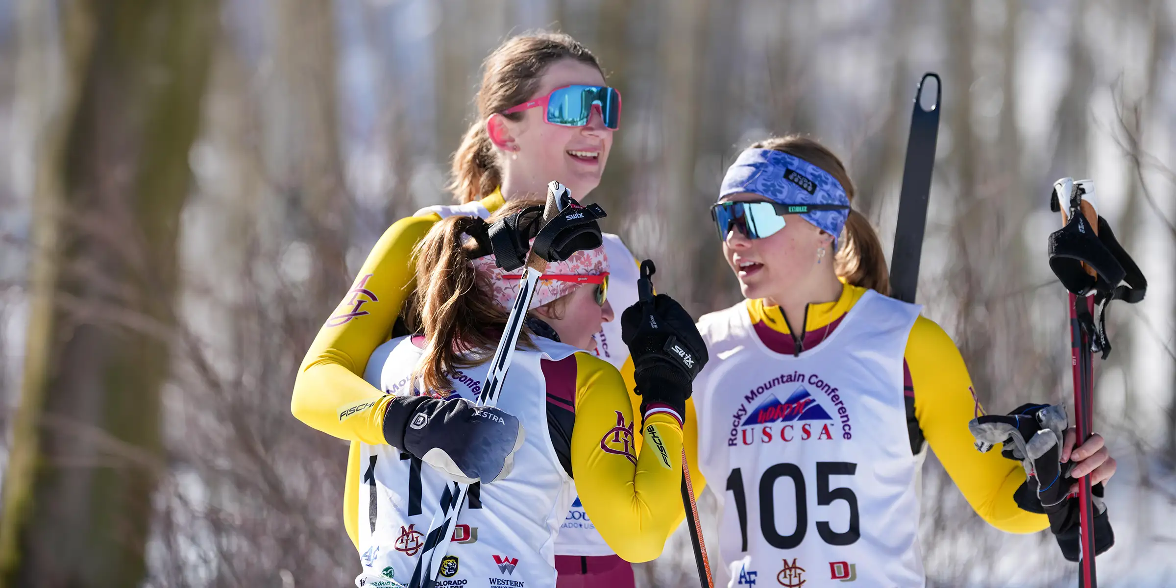 CMU women cross country skiers together after racing