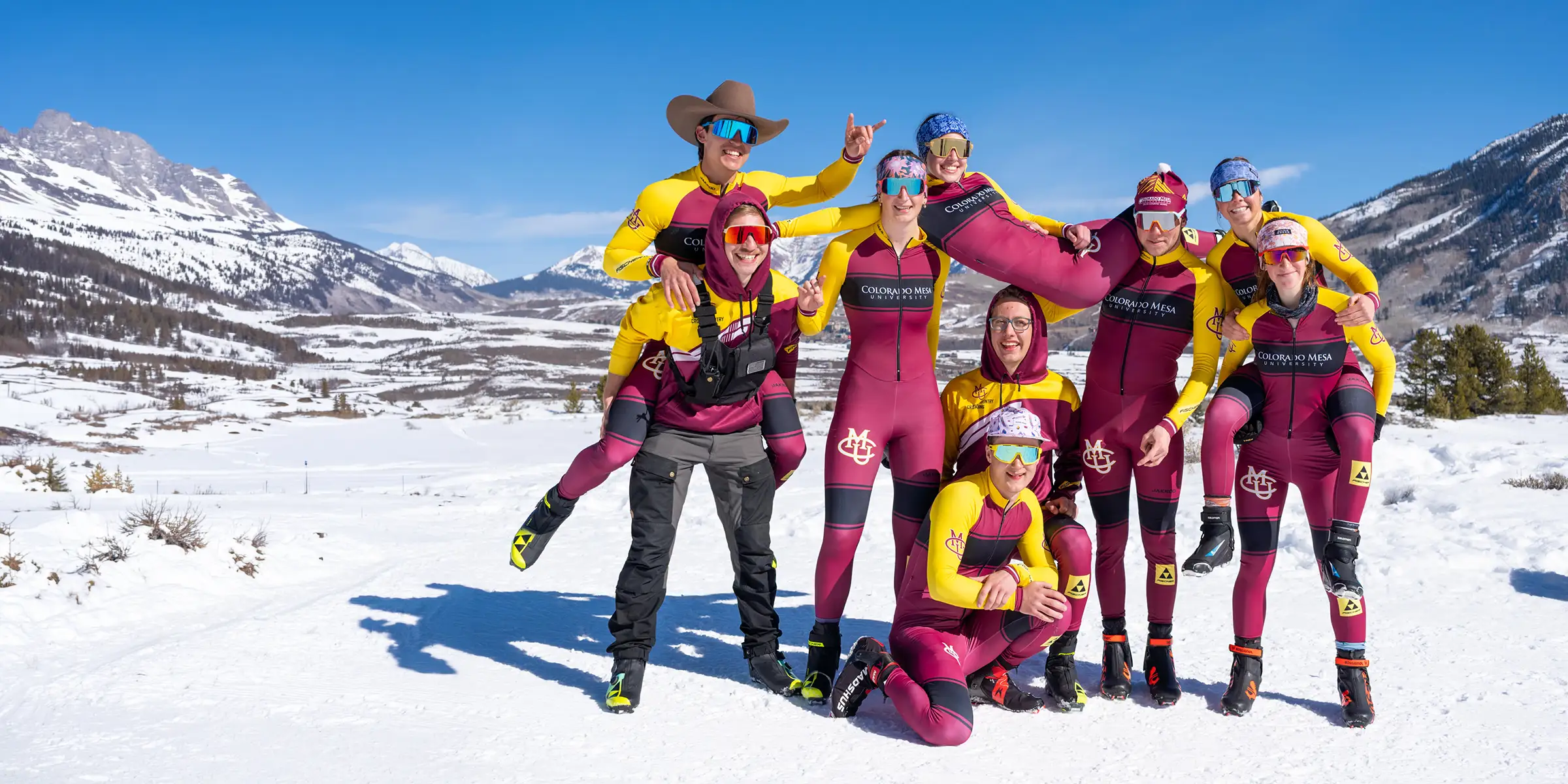CMU Cross Country Ski Team members together in a snowy mountain valley