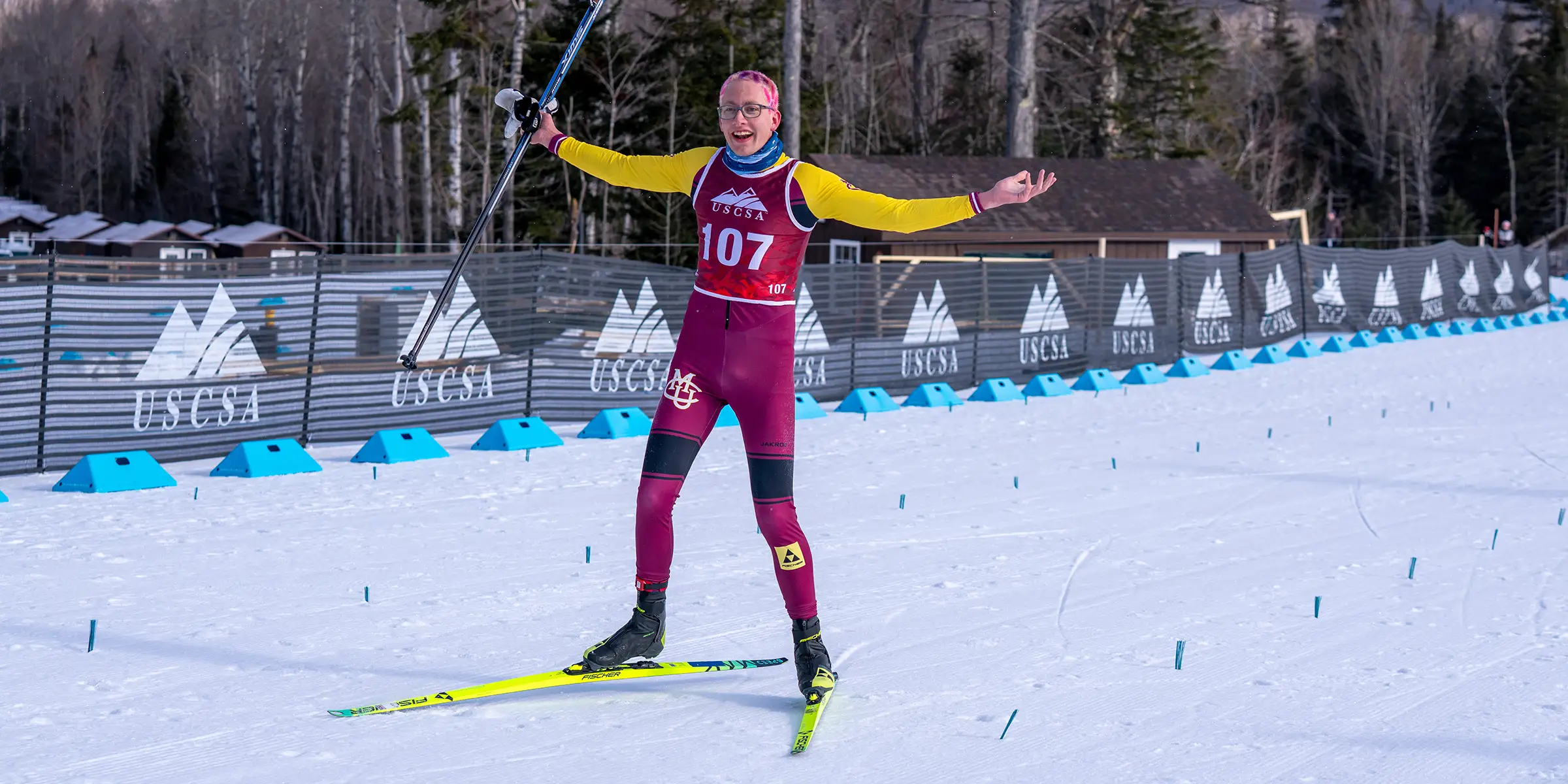 CMU cross country skier celebrating after a race