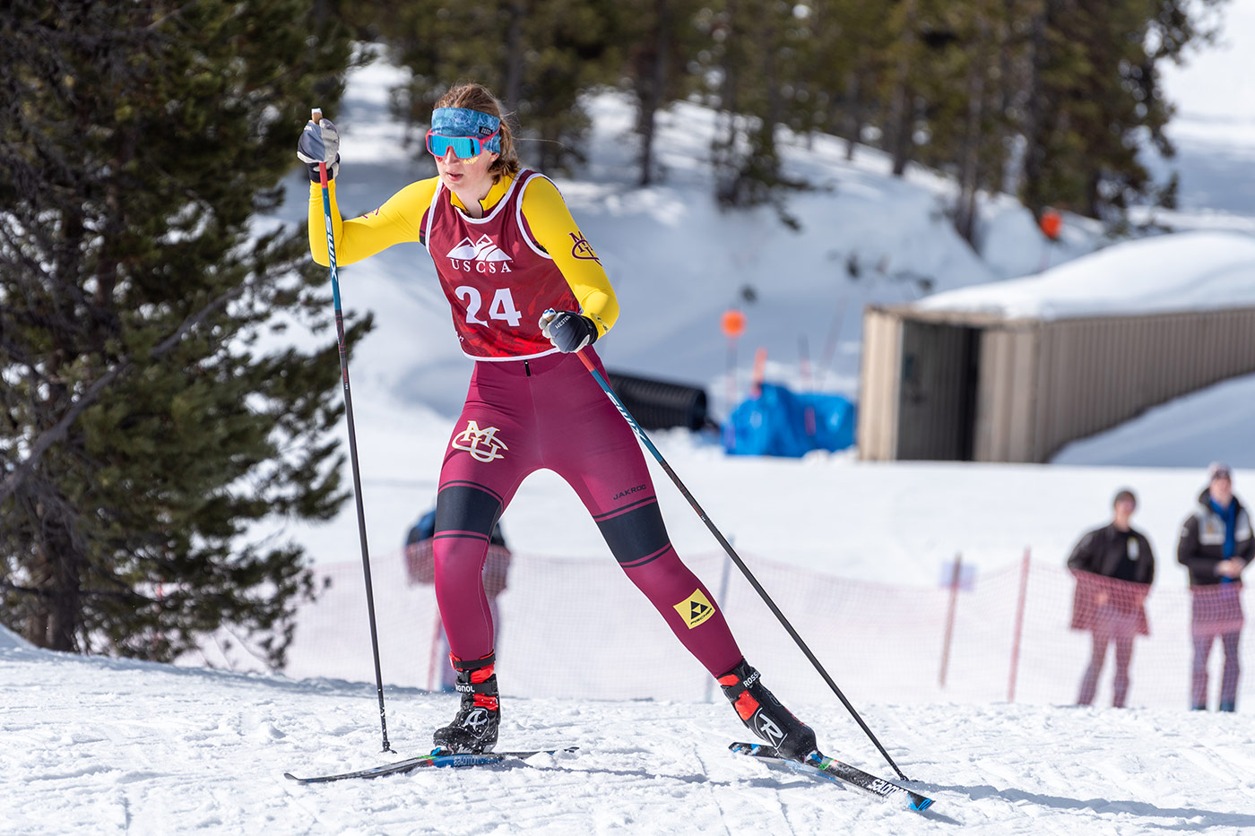 CMU cross country skier skate skiing during a USCSA race, demonstrating powerful skating technique and pole angles discussed in the ski and pole length research article.