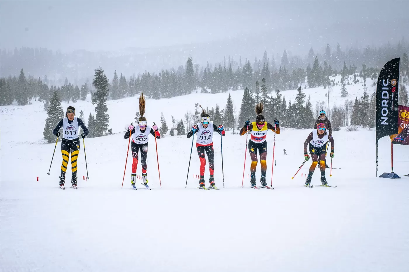 Photo of college ski racers during USCSA race at Snow Mountain Ranch in January 2024.