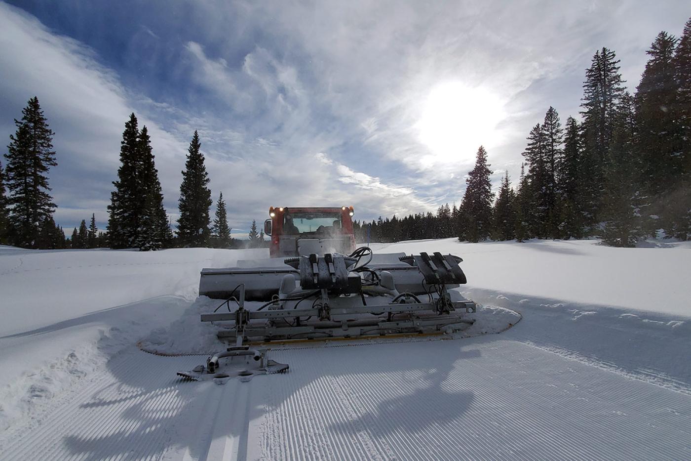 Snow groomer on the cross country ski trail